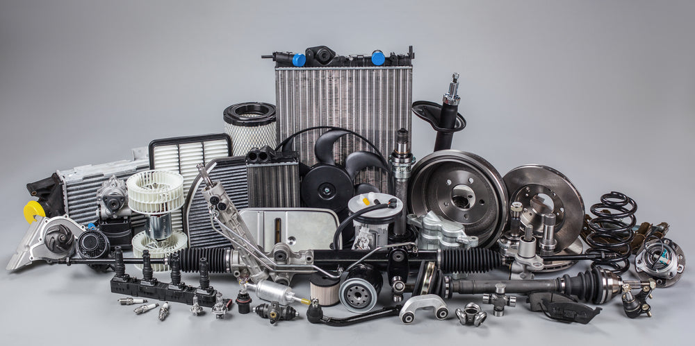Collection of car parts on a gray background